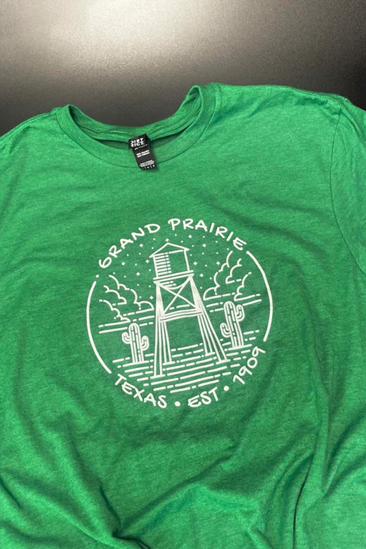 Green t-shirt with white graphic design and 'Grand Prairie, Texas' text on a gray background